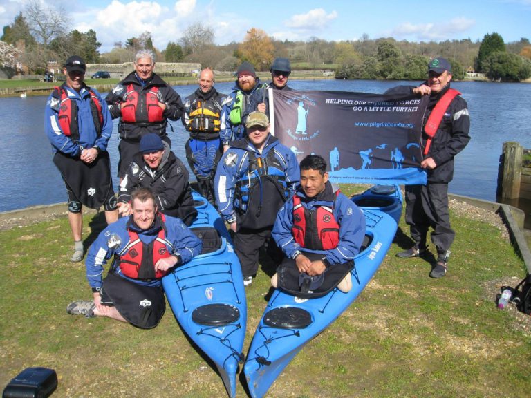 men and kayaks